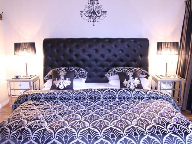 The Fleur De Lis' king size bed.