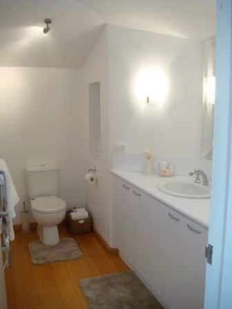 Separate bathroom with shower, vanity and toilet