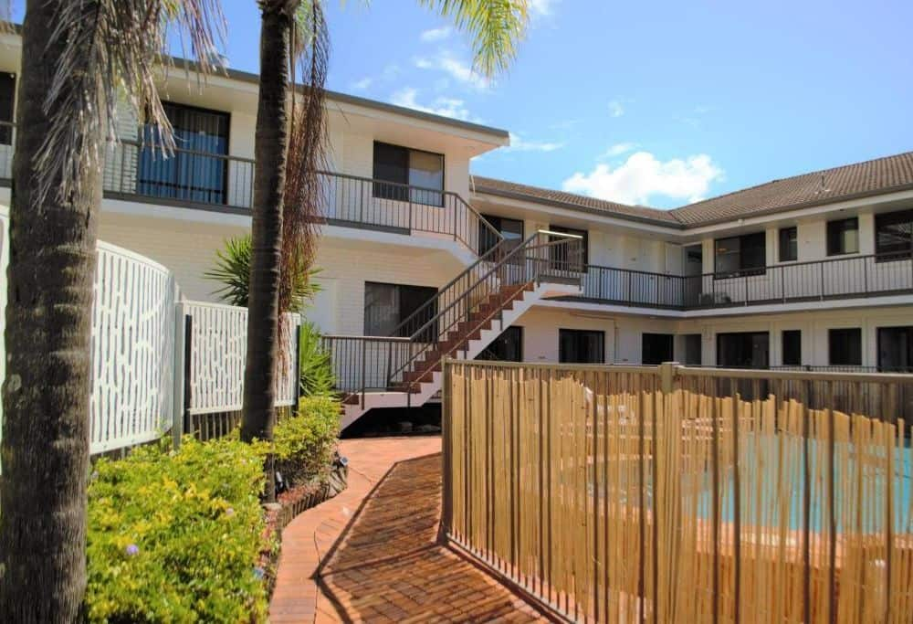 Pathway to room via pool